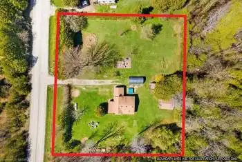 0.7 acre property mostly cleared and leveled out with big open grass space!